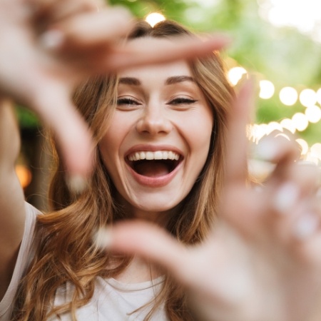 Woman showing off smile after makeover