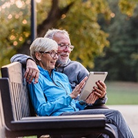 couple enjoying benefits of dental implants in White Plains