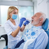 Dentist performing consultation for dental implants in White Plains