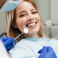 Woman at dental checkup smiling