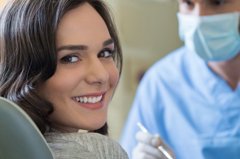 patient who had dental implant surgery smiling